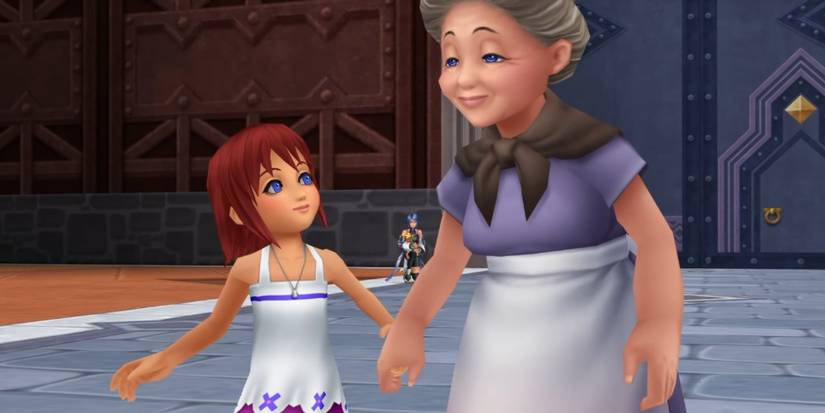 Kairi holding her grandma's hand as they walk through Hollow Bastion