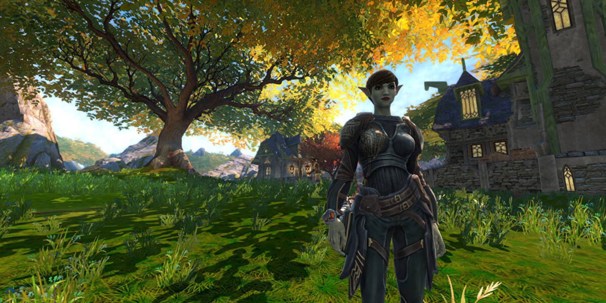 An elven looking character standing in front of a tree in Kingdoms of Amalur: Reckoning