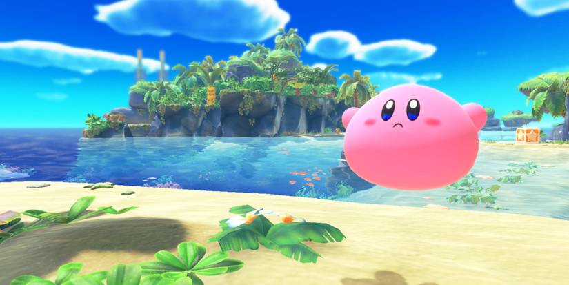 Kirby floats above a beach