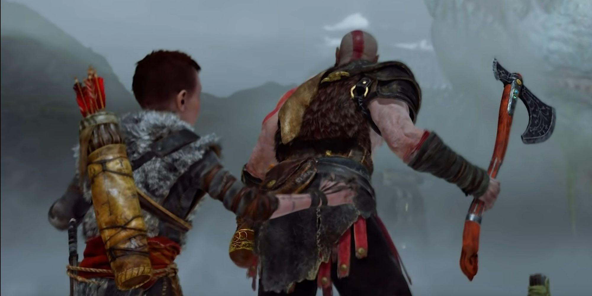 Kratos protecting Atrues 