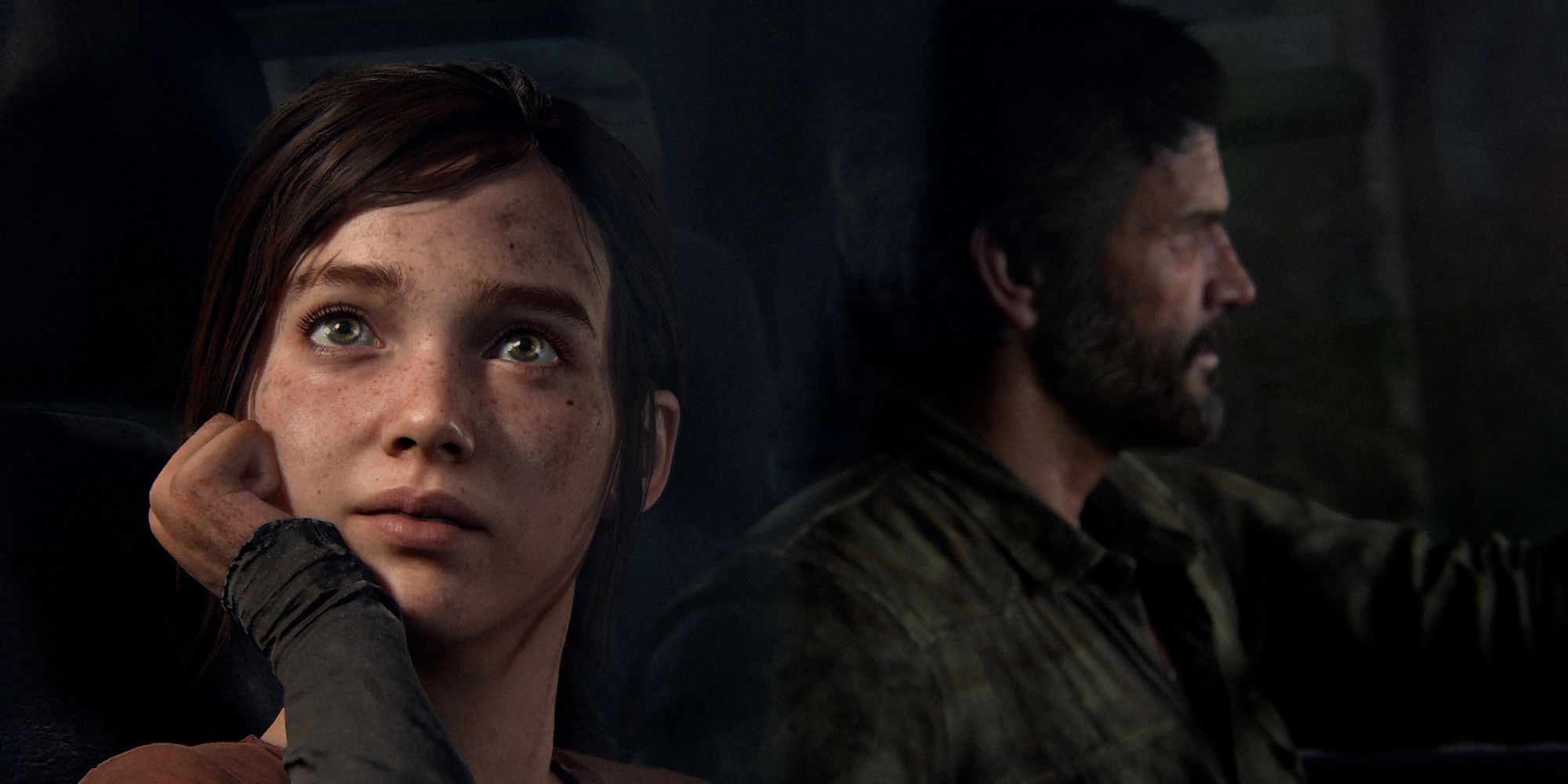 Joel and Ellie of The Last Of Us sitting in a conversation.