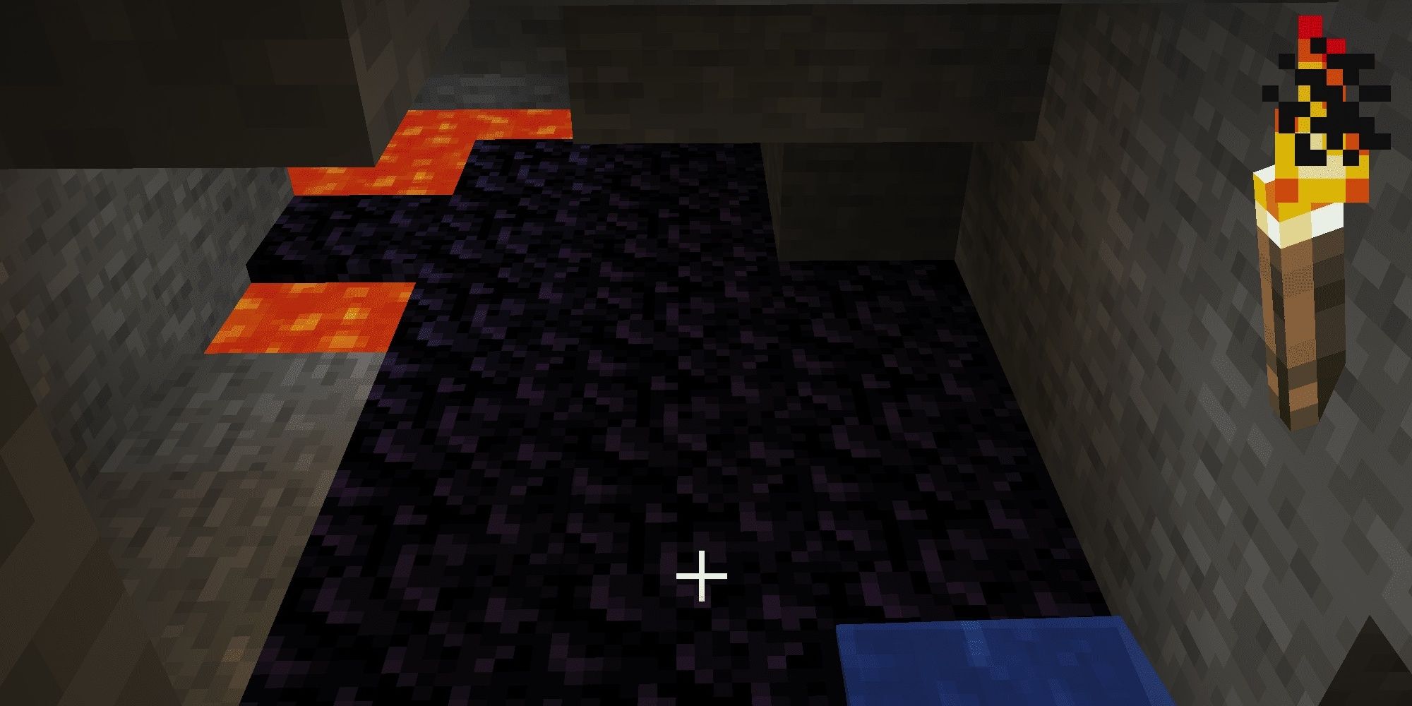 Obsidian in a cave with lava and water in Minecraft