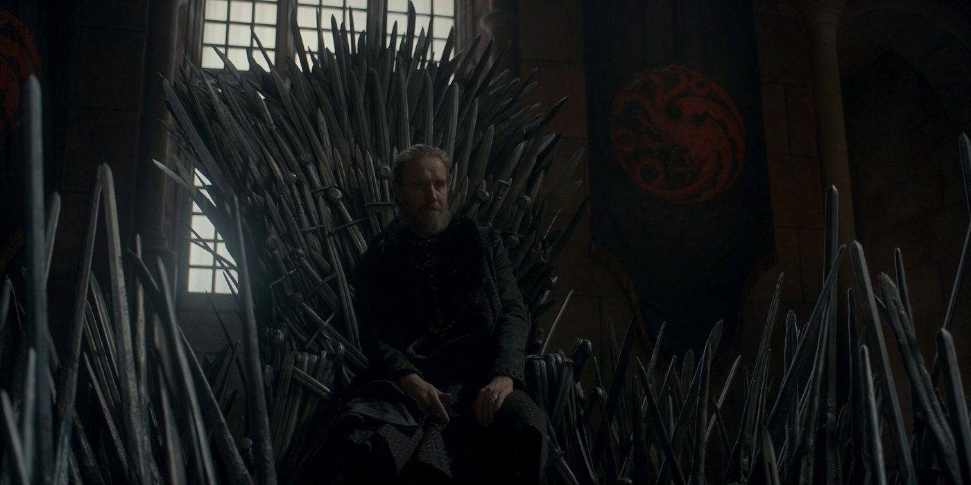 Otto Hightower sitting on the Iron Throne.