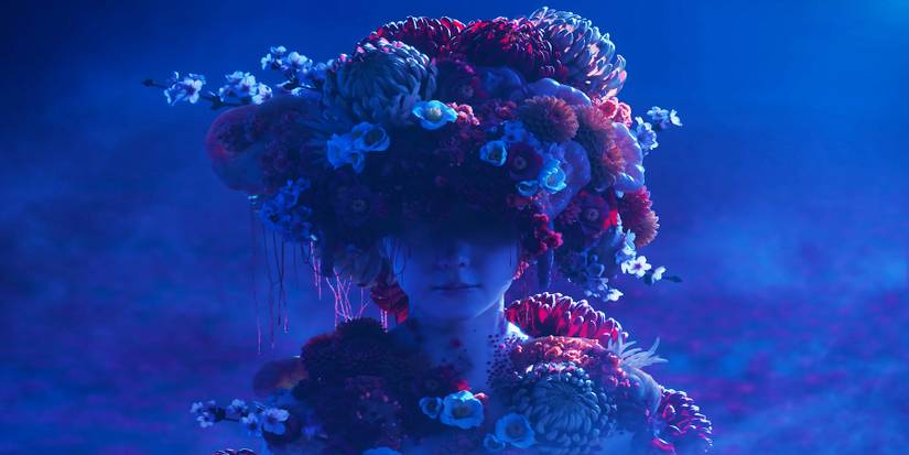 A girl from Silent Hill f's trailer overrun with flowers