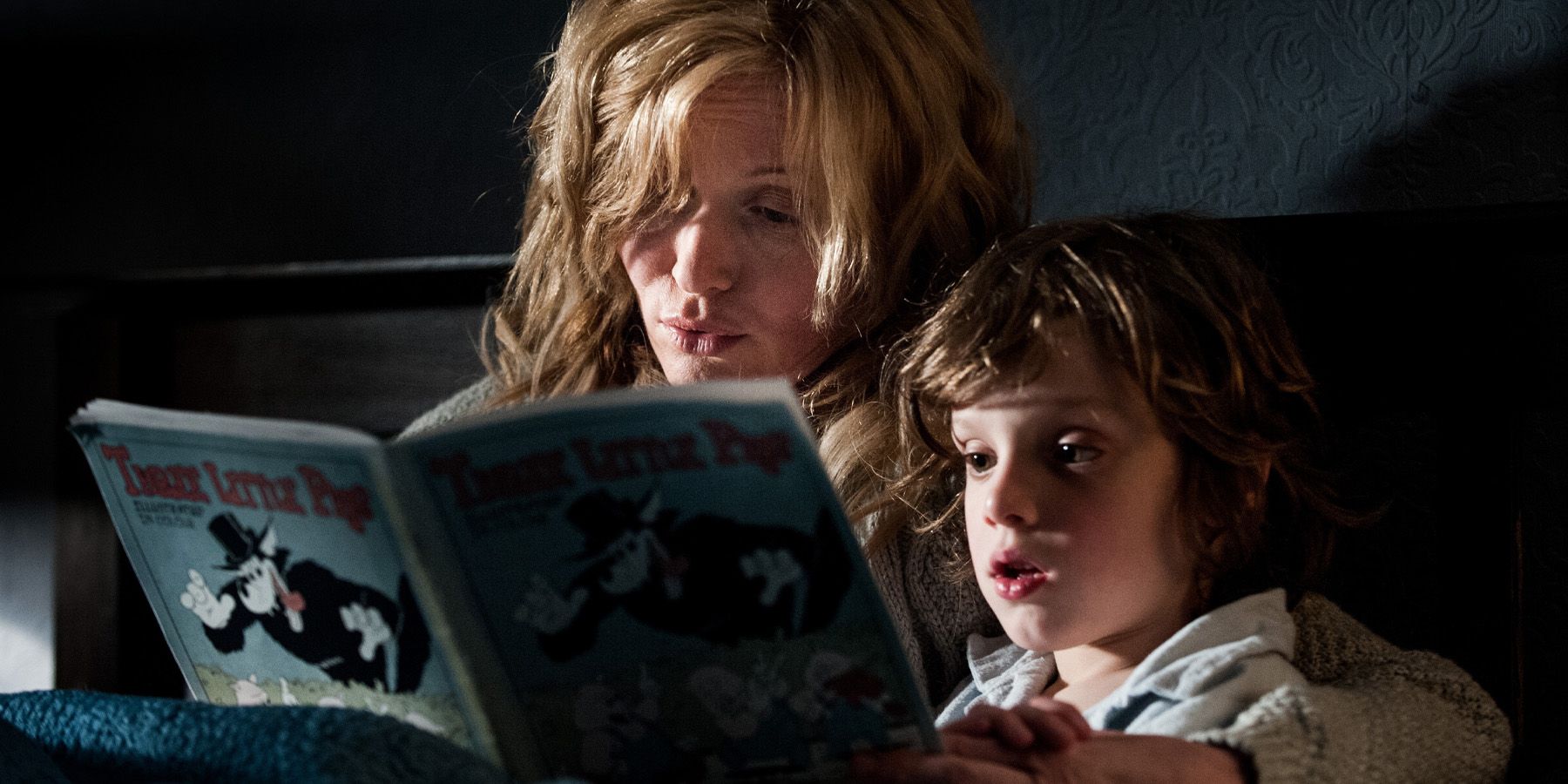 A mother and her child reading a book in The Babadook