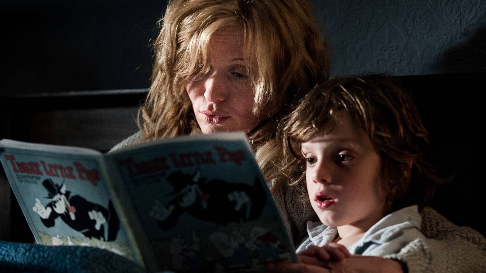 A mother and her child reading a book in The Babadook