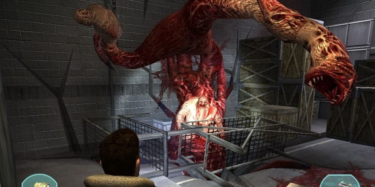 A horrific mutated monster lurches out from a vent, elongated snapping maws heading towards the player.