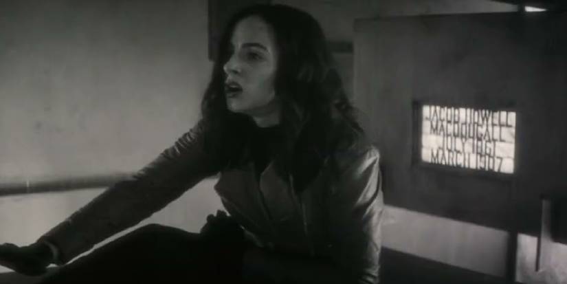 Elsa sitting in front of a tomb in Werewolf by Night