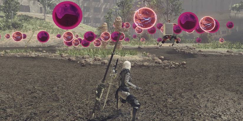 A2 from Nier Automata surrounded by projectiles.