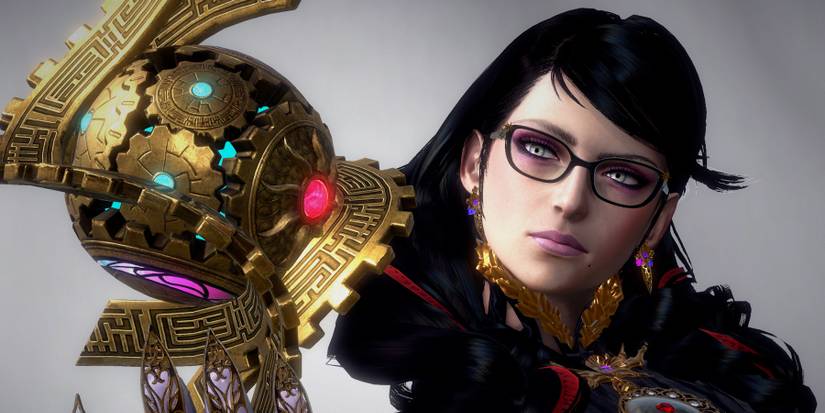 Close up of Bayonetta holding a golden orb in Bayonetta 3
