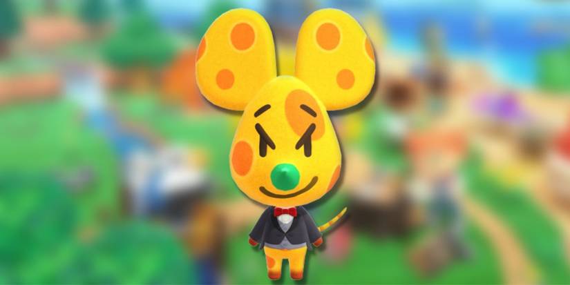 Chadder, a yellow cheese-patterned mouse wearing a tuxedo, , on a blurred green background.