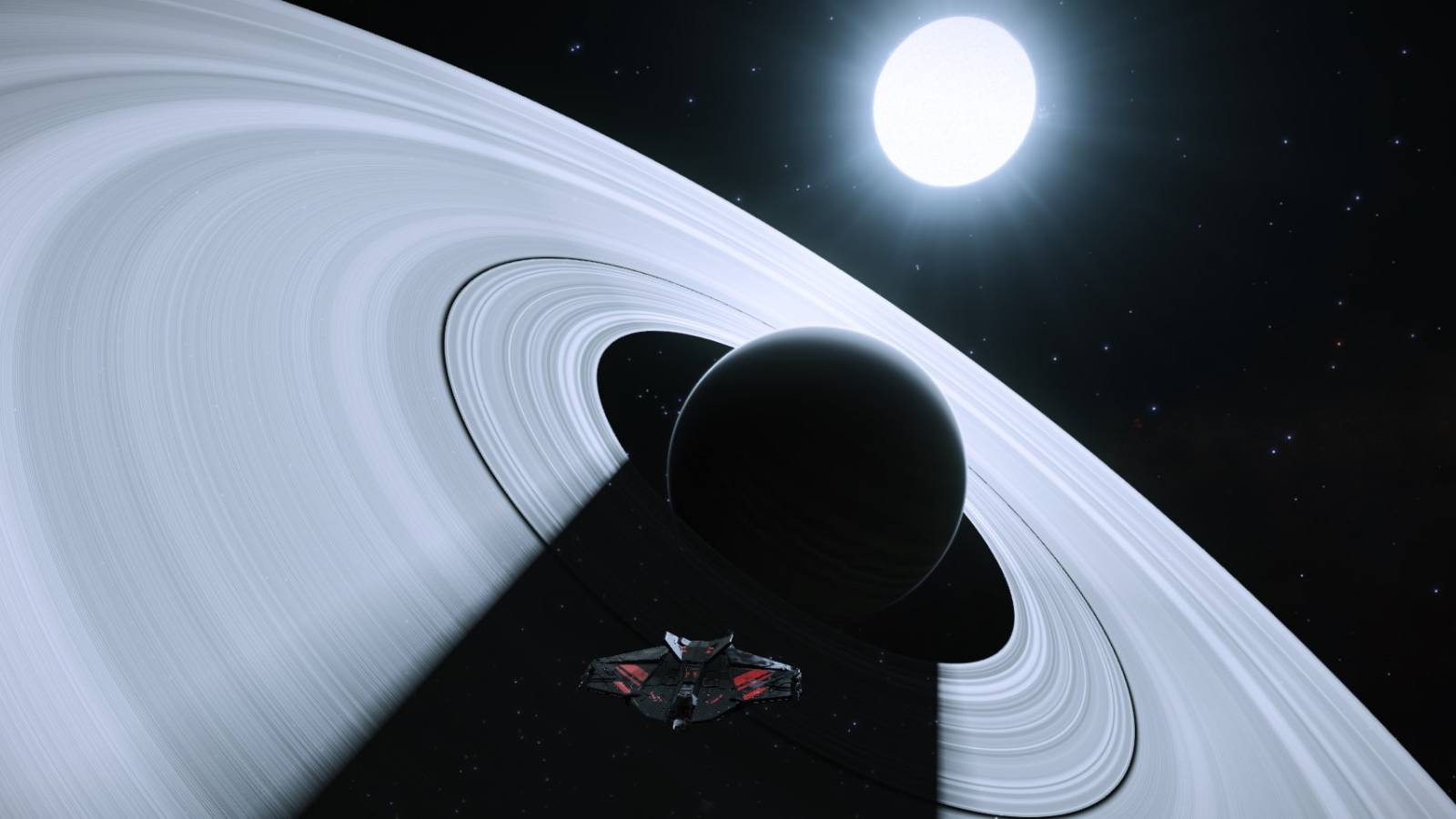 A Krait Phantom hovering in the shadow cast by a small planetoid upon its massive set of rings.