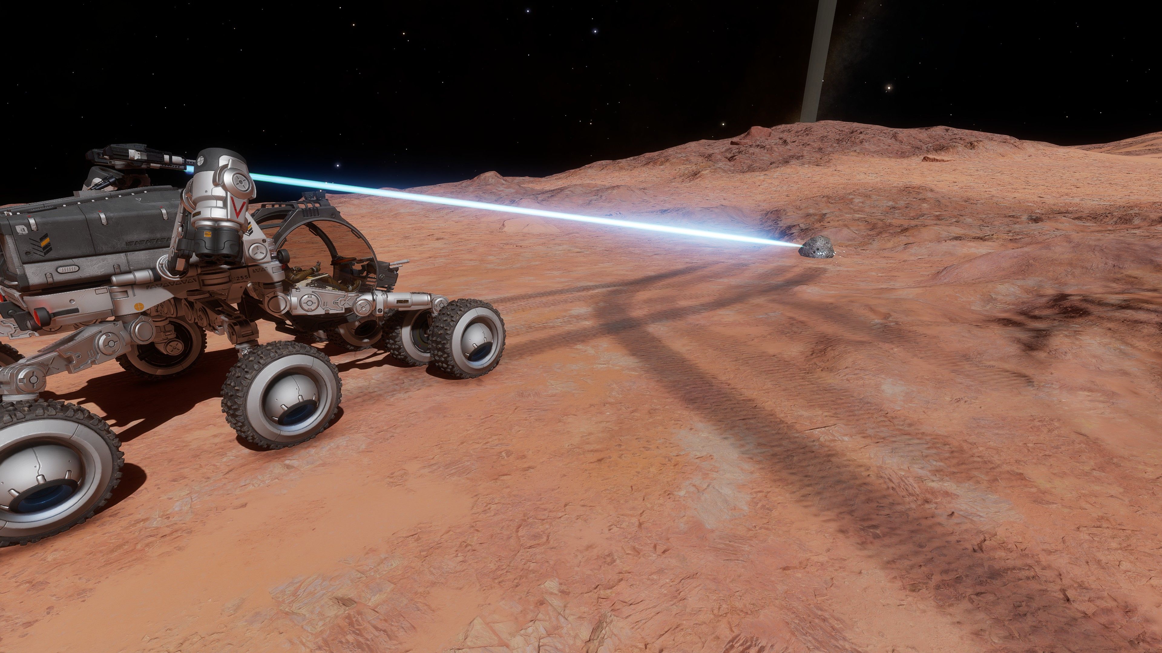 An SRV firing a laser into a node