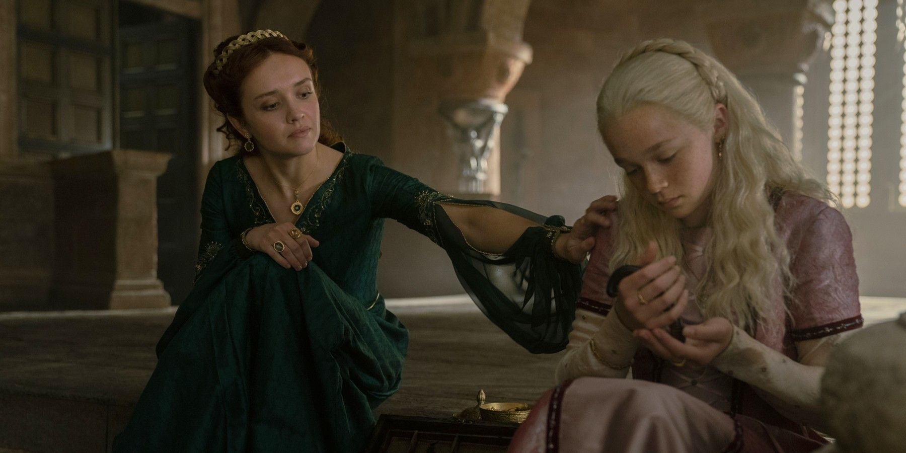 Alicent Hightower (Olivia Cooke) and Helaena Targaryen (Evie Allen) in House of the Dragon