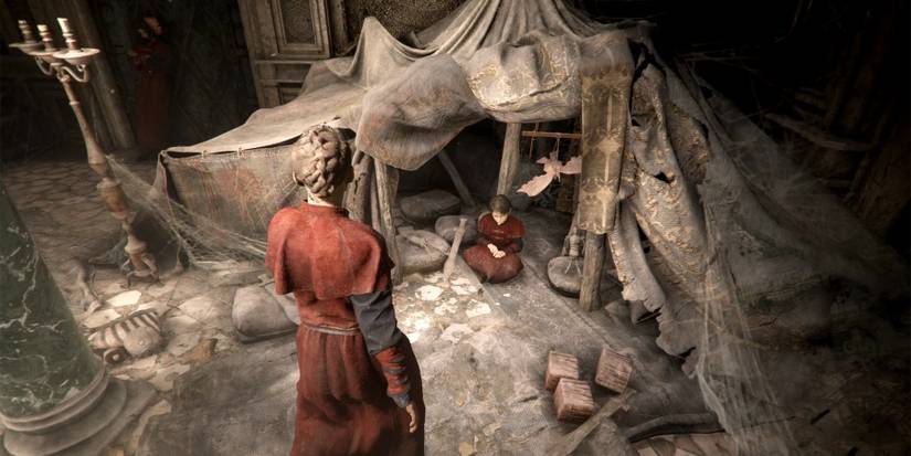 hugo inside a tent in a plague tale requiem
