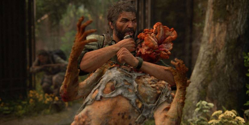 Joel using a shiv on a Clicker in The Last of Us Part 1