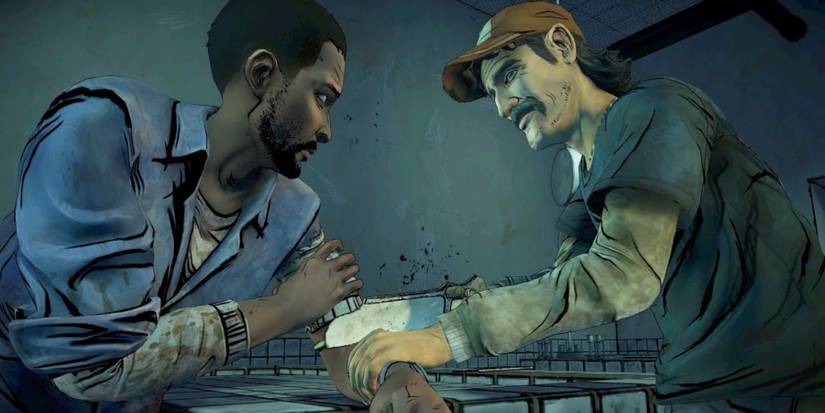 Kenny cutting Lee's arm off in The Walking Dead