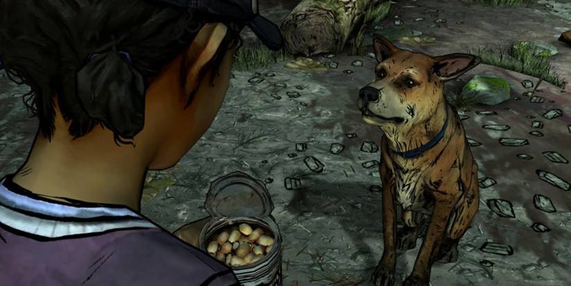 Clem and a stray dog in The Walking Dead