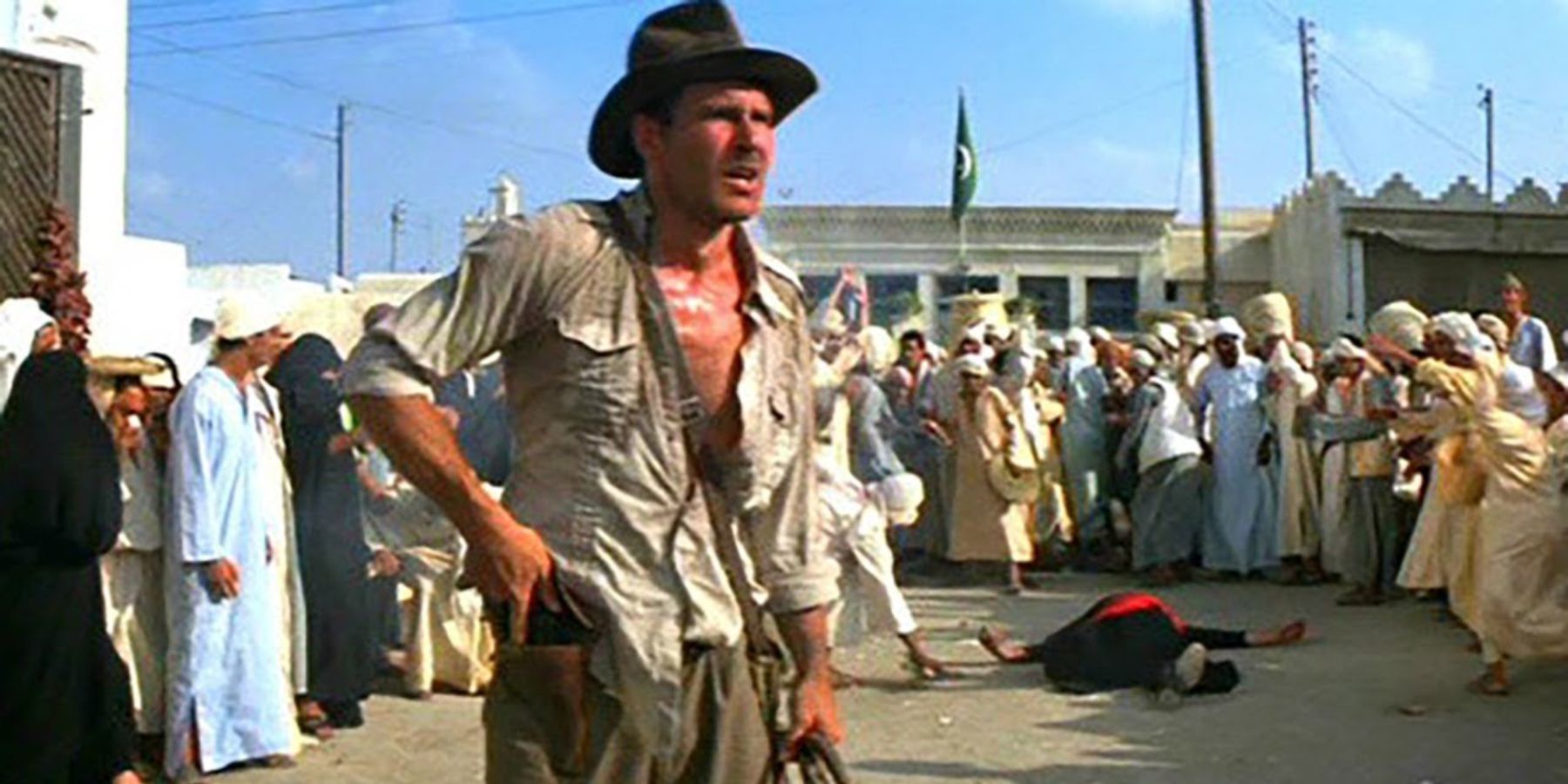 Indiana Jones holsters his pistol in Indiana Jones: Raiders of the Lost Ark