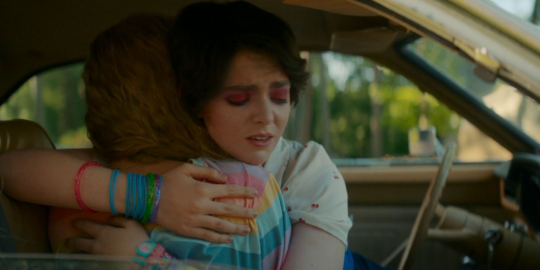 Gretchen and Abby hugging in a car in My Best Friend's Exorcism