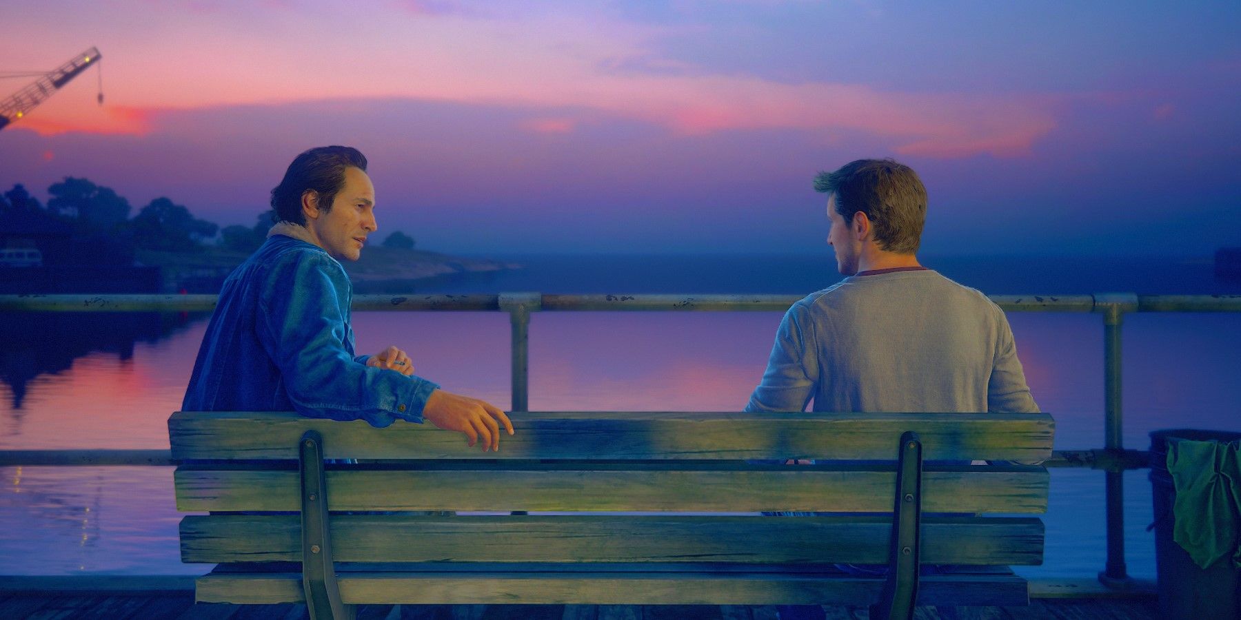 Nathan and Sam Drake talking on a bench Uncharted 4