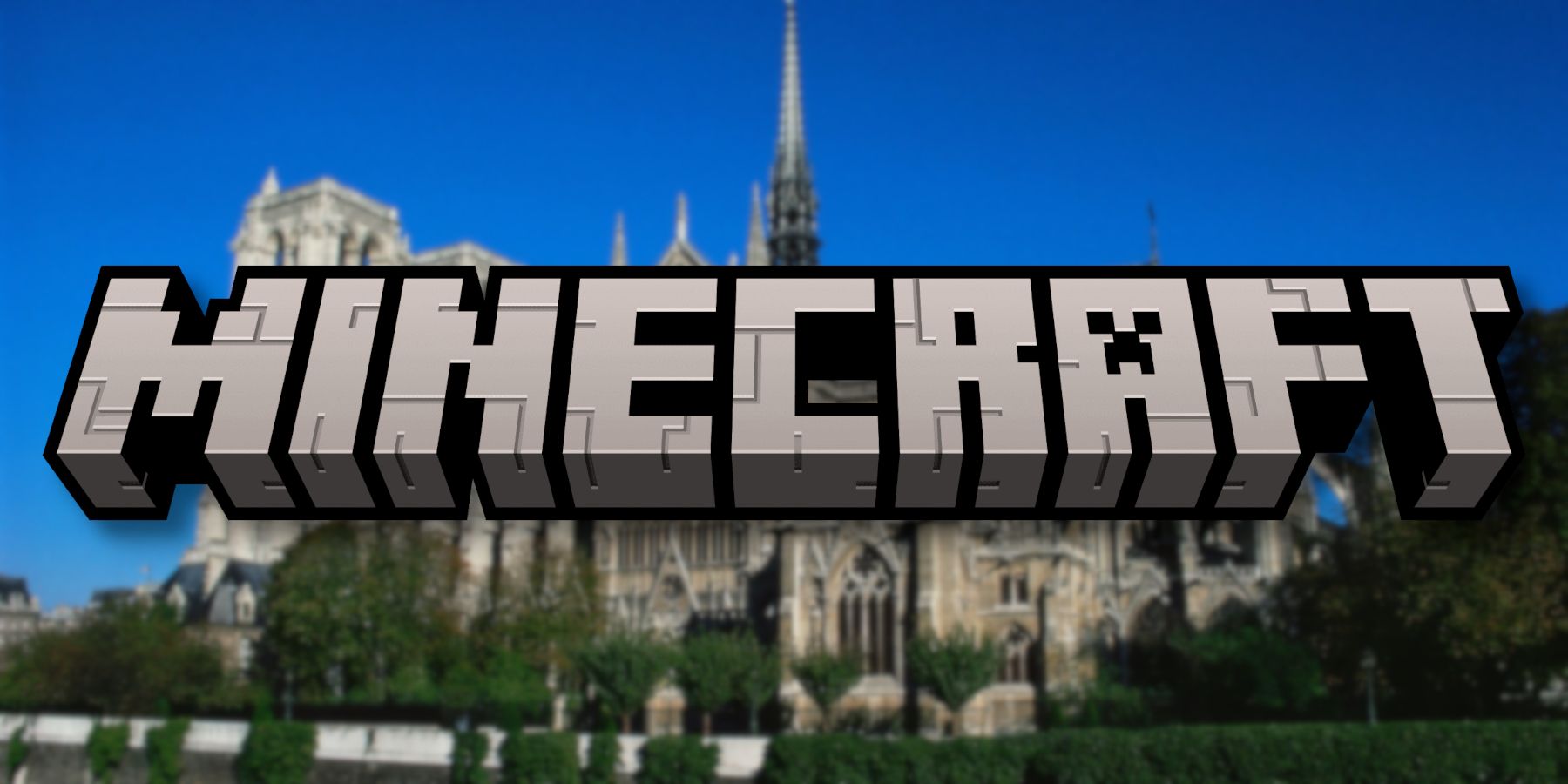 Slightly blurry photo of the Notre Dame Cathedral with the Minecraft logo in front of it.