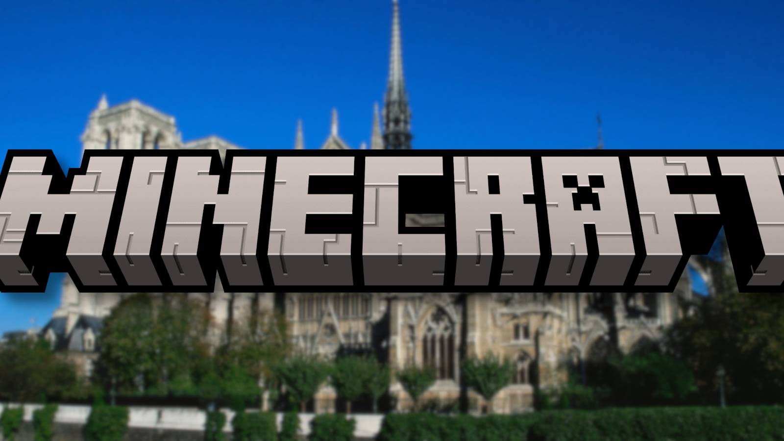 Slightly blurry photo of the Notre Dame Cathedral with the Minecraft logo in front of it.