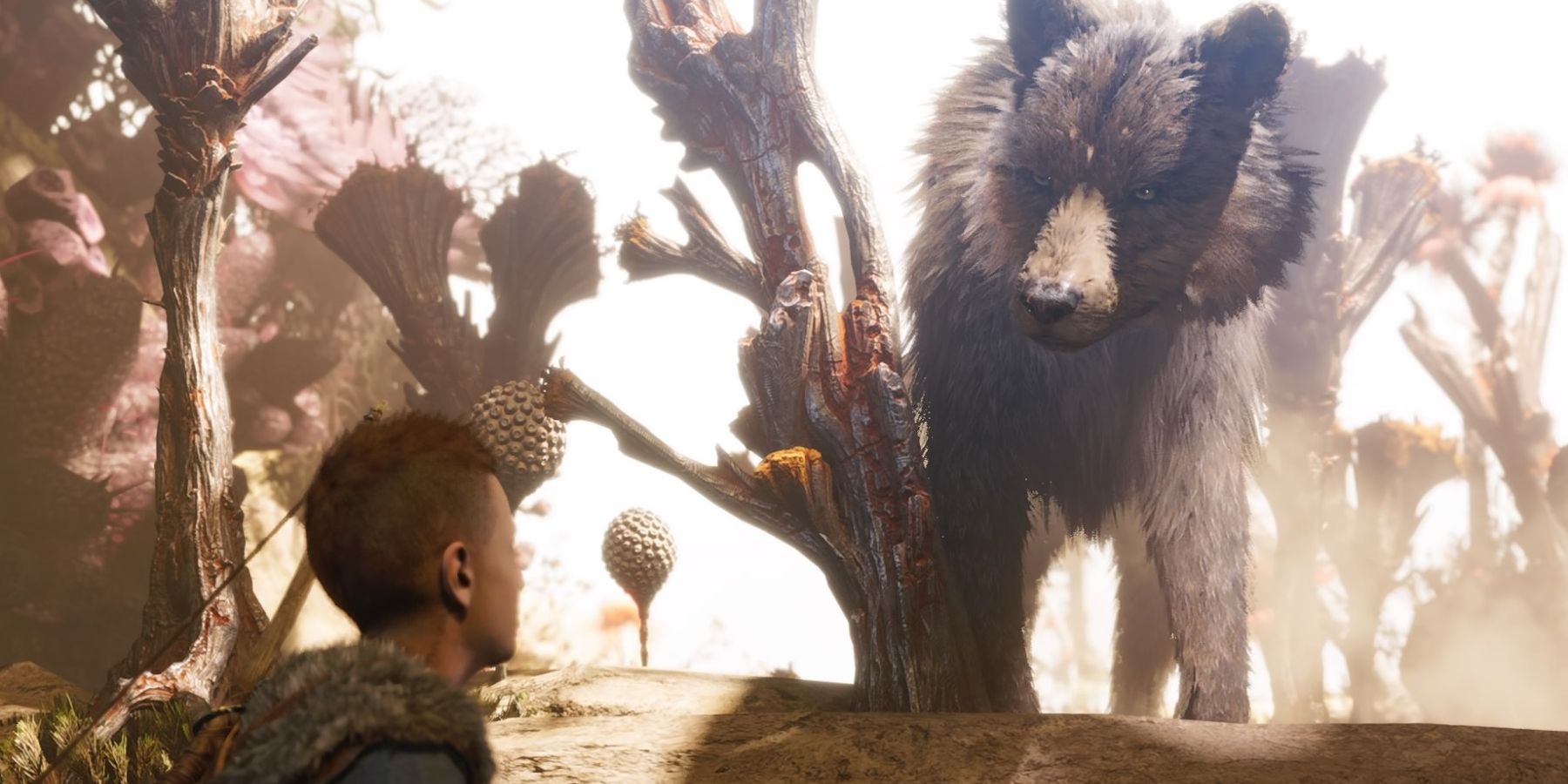 Atreus meets a wolf in God of War Ragnarok