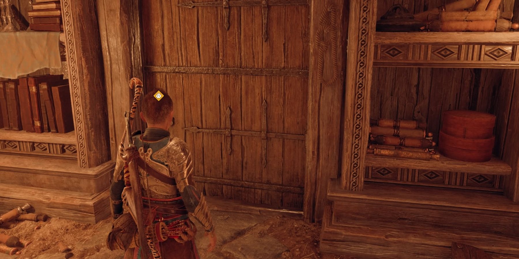 Atreus faces the door to his room in God of War Ragnarok