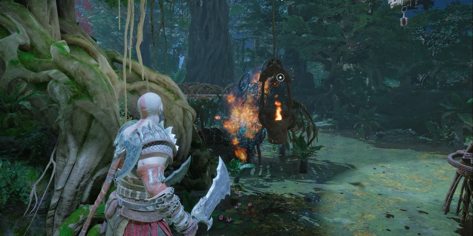 Kratos uses a flaming pot to burn brambles in God of War Ragnarok