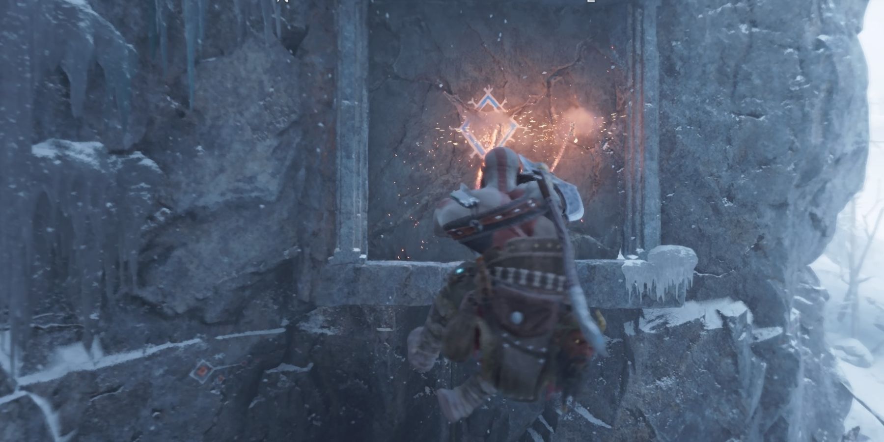 Kratos uses the Blades of Chaos to break through a wall in God of War Ragnarok