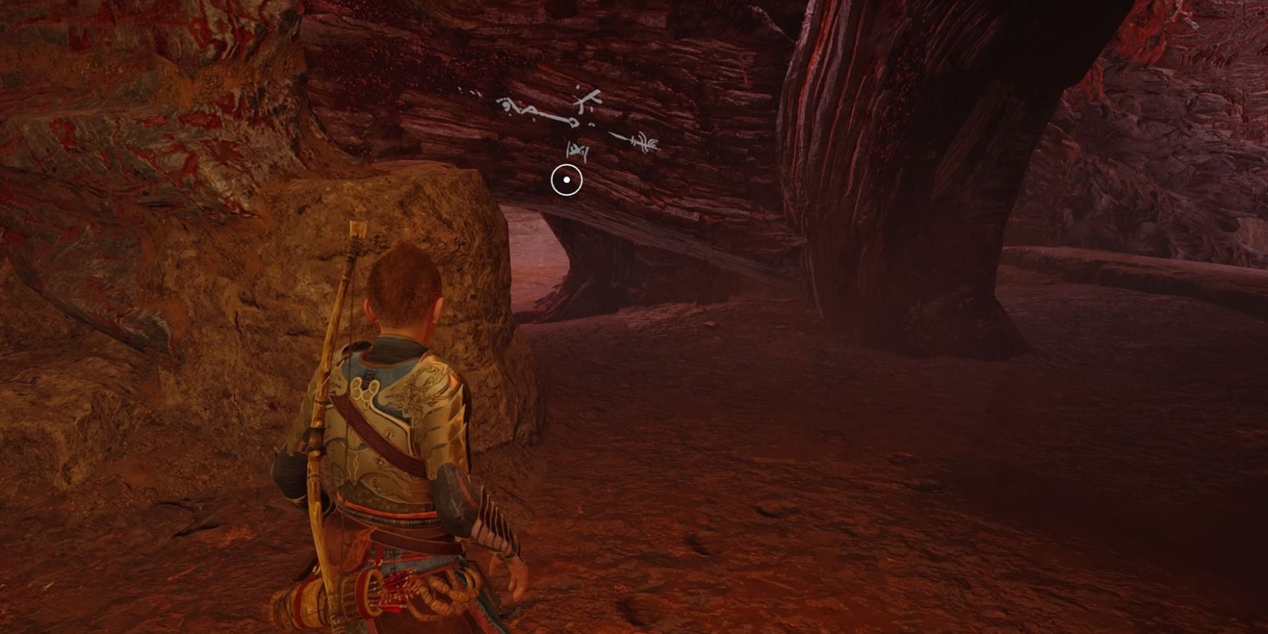 Atreus faces a hole in a tree in God of War Ragnarok