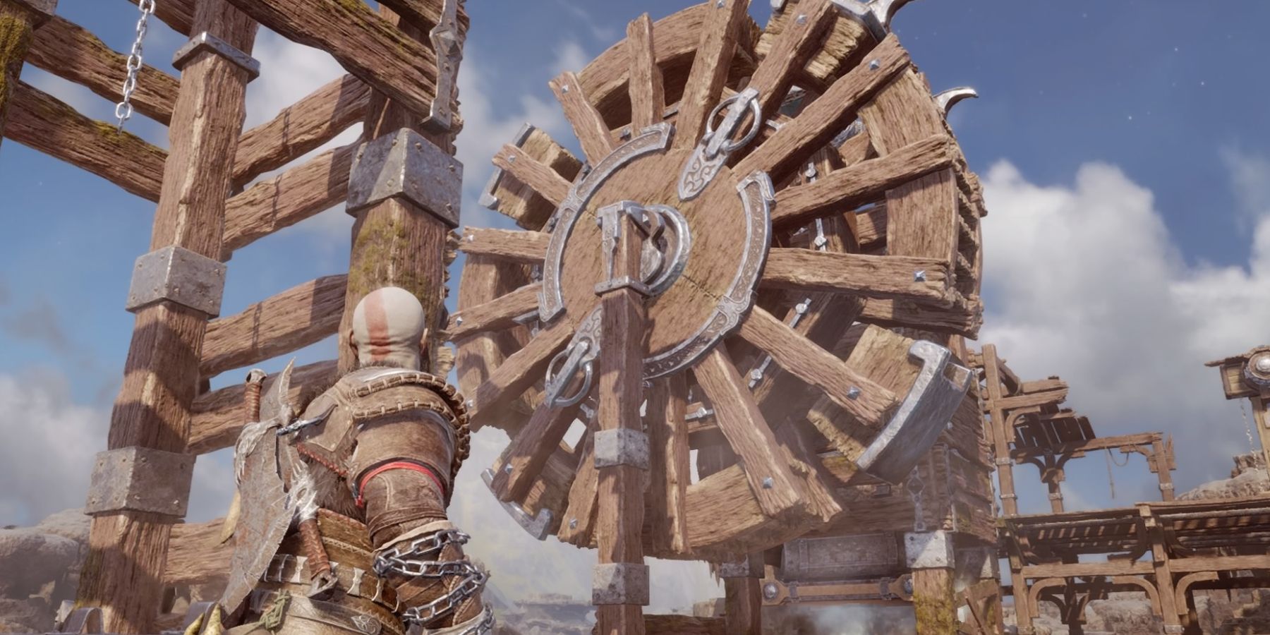 Kratos faces a giant water wheel in God of War Ragnarok