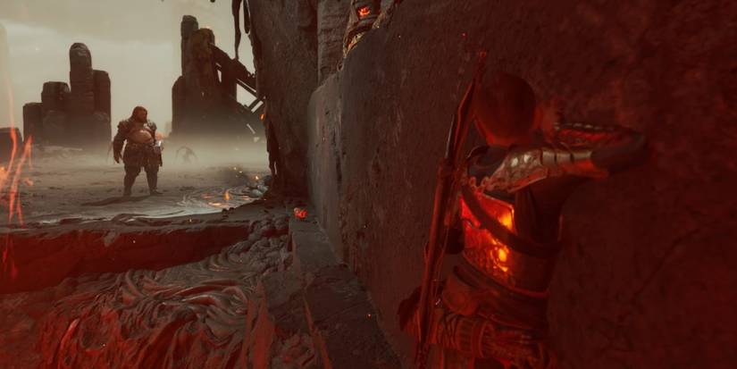 Atreus shimmies against a wall in God of War Ragnarok