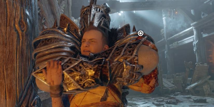 Atreus gets grabbed by an Einherjar Captain in God of War Ragnarok