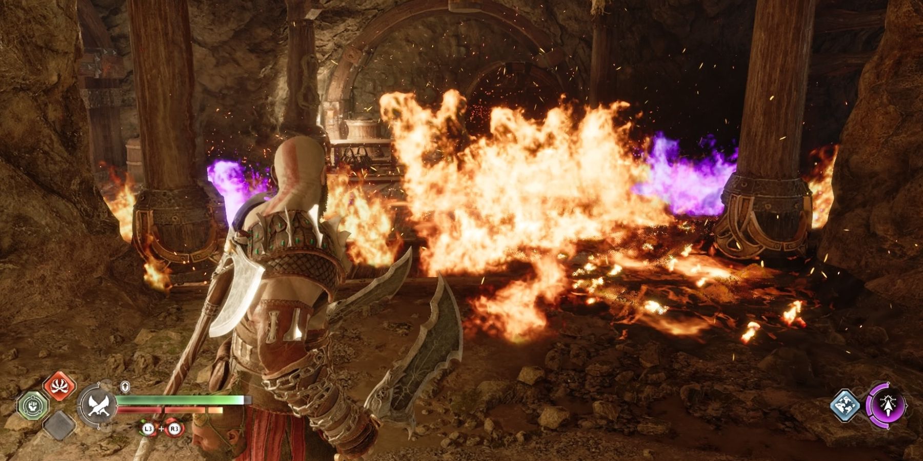 Kratos sets fire to an oil spill in God of War Ragnarok
