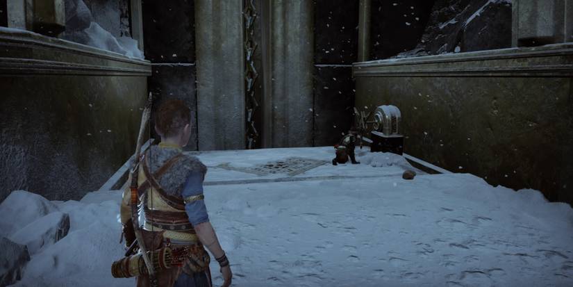 Atreus watches as Sindri repairs a life in God of War Ragnarok