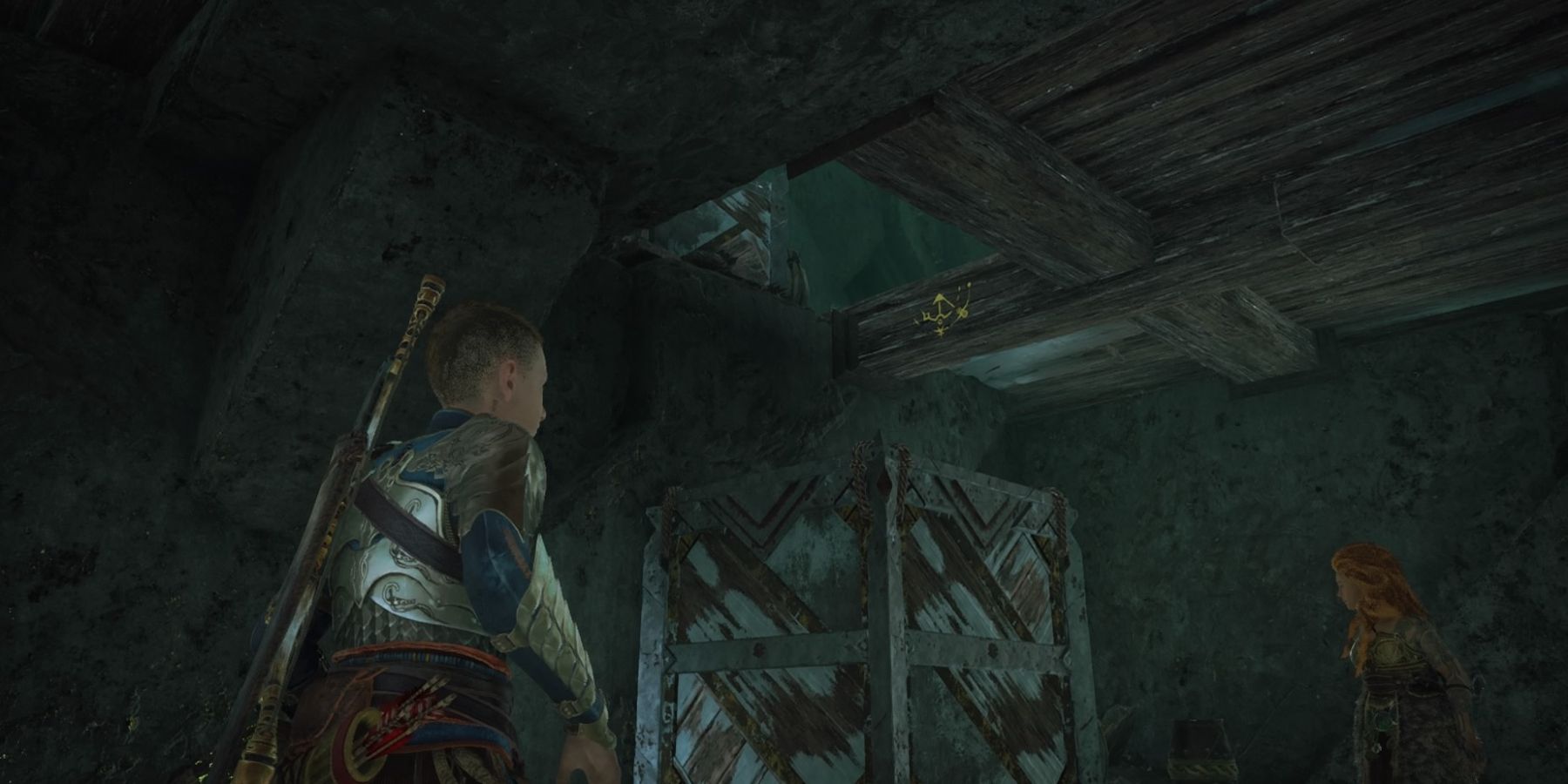 Atreus prepares to climb a block in God of War Ragnarok