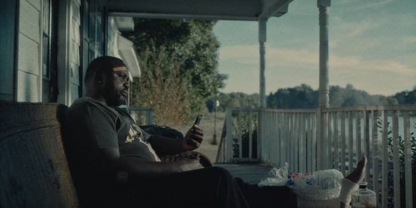 Brian Tyree Henry as Al sitting in lake house Atlanta season 4