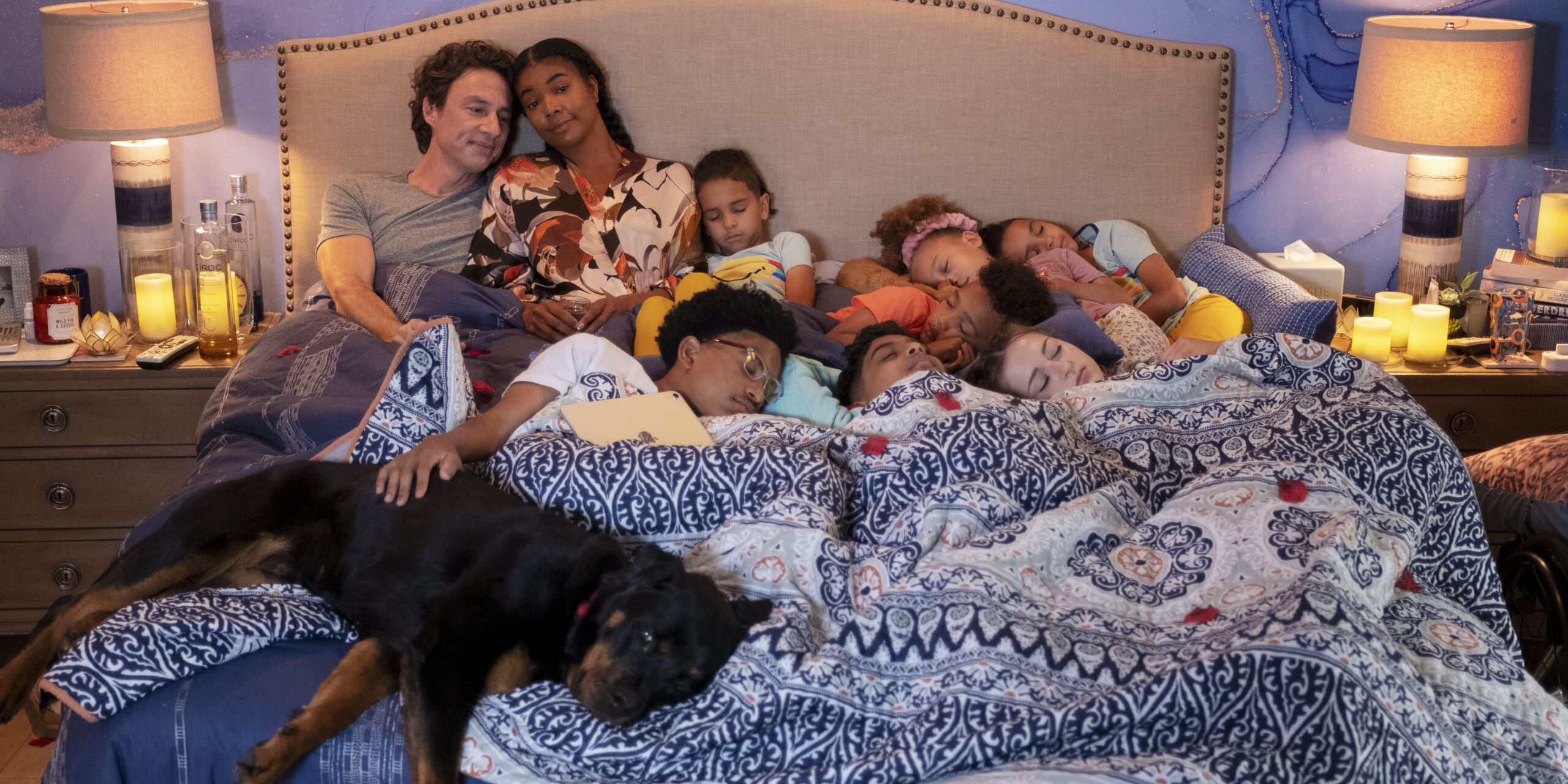 Cheaper By The Dozen 2022 The Bakers all cuddle together in bed