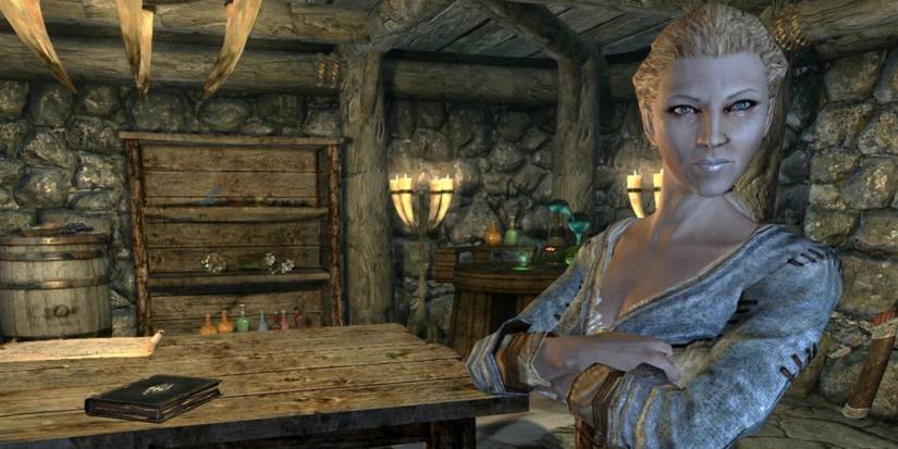 Delphine of the Blades standing in the secret based of The Bannered Mare