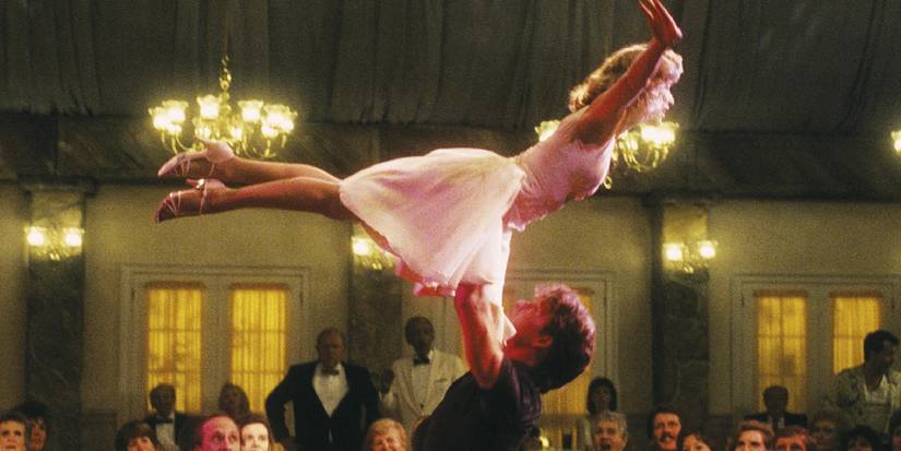 Patrick Swayze lifting Jennifer Grey into the air in Dirty Dancing