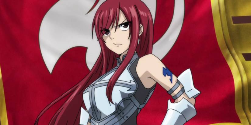 Erza Scarlet standing in front of the Fairy Tail flag as she is coronated as the seventh guild master.