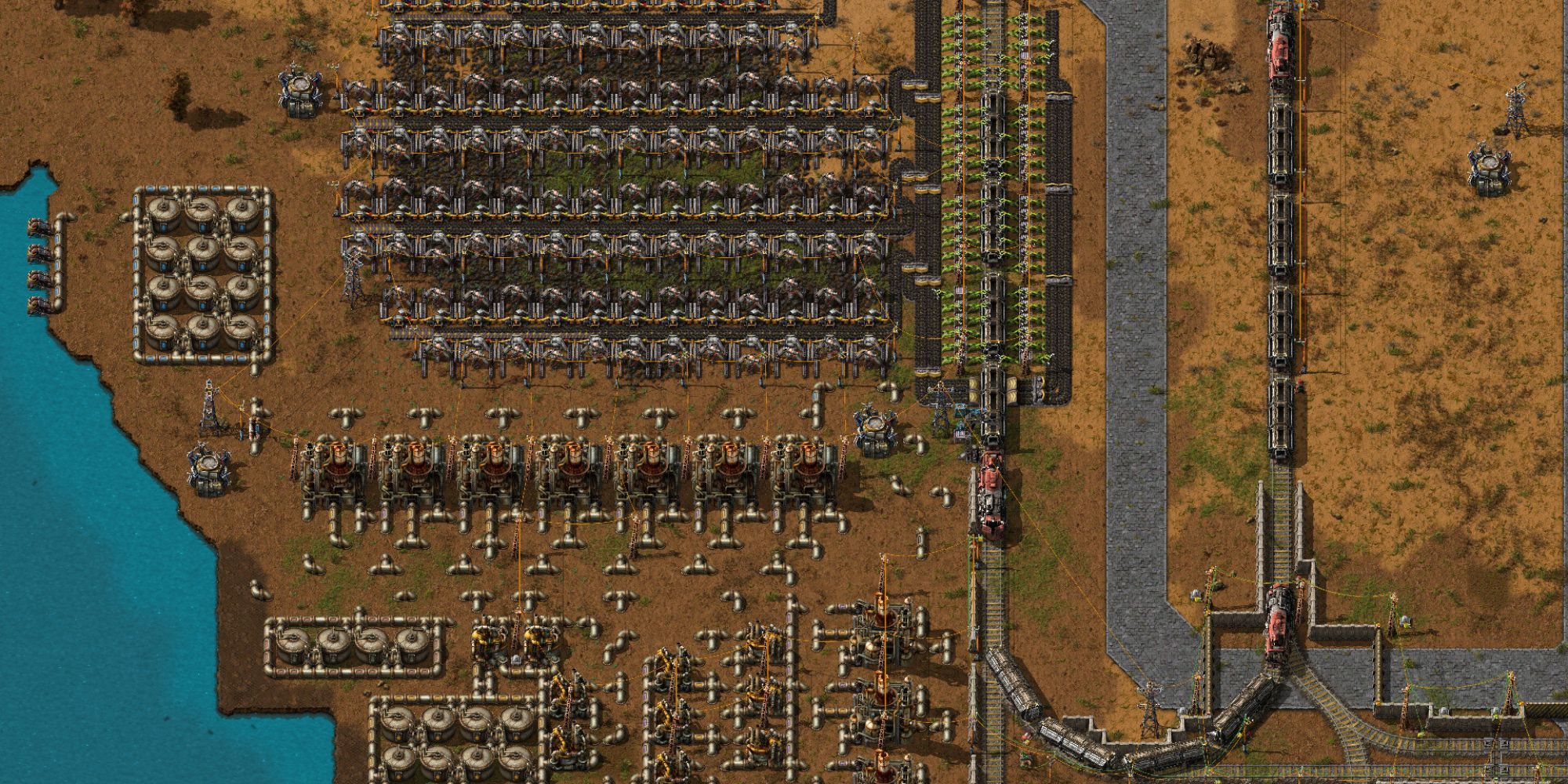 A train bringing resources to machines in Factorio