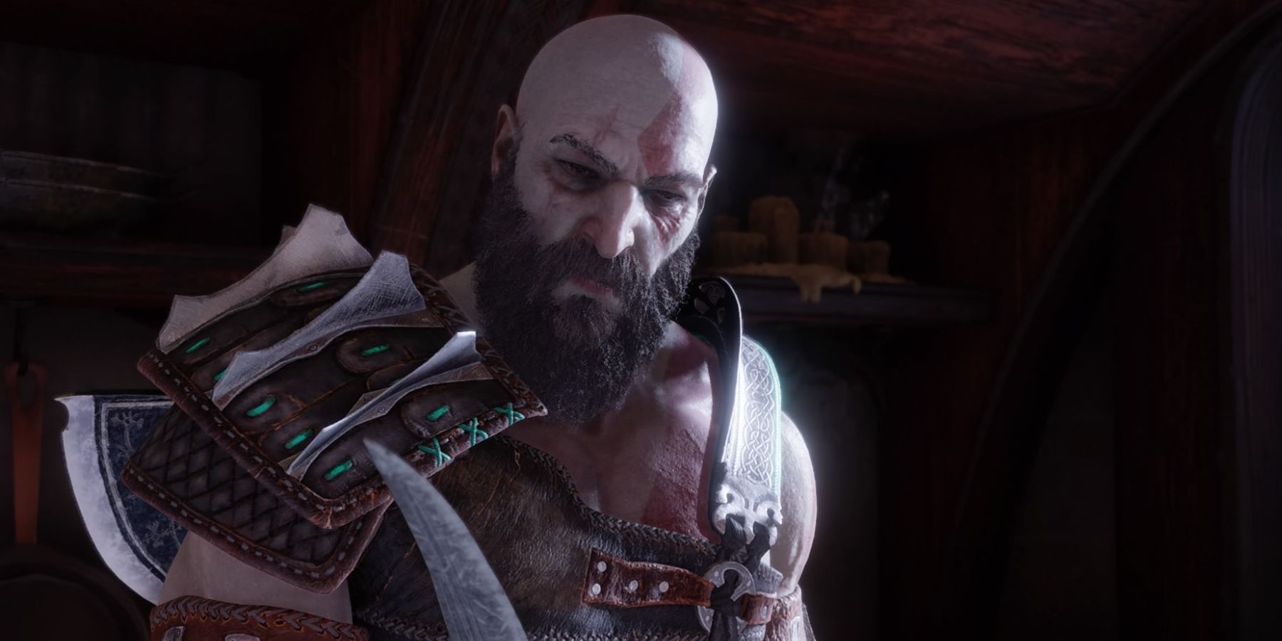 Kratos holds Atreus' knife in God of War Ragnarok