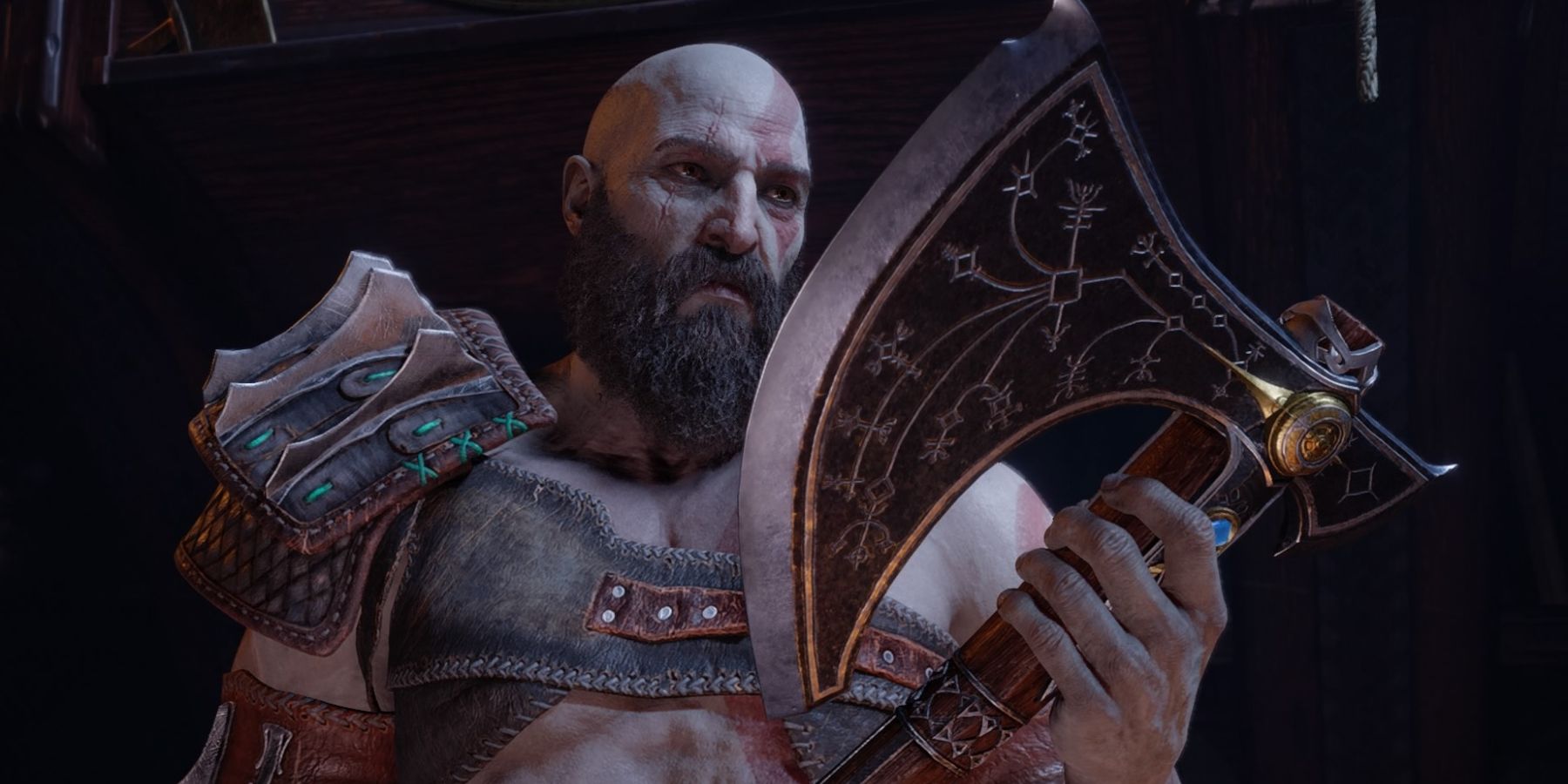 Kratos holds the Leviathan Axe in God of War Ragnarok