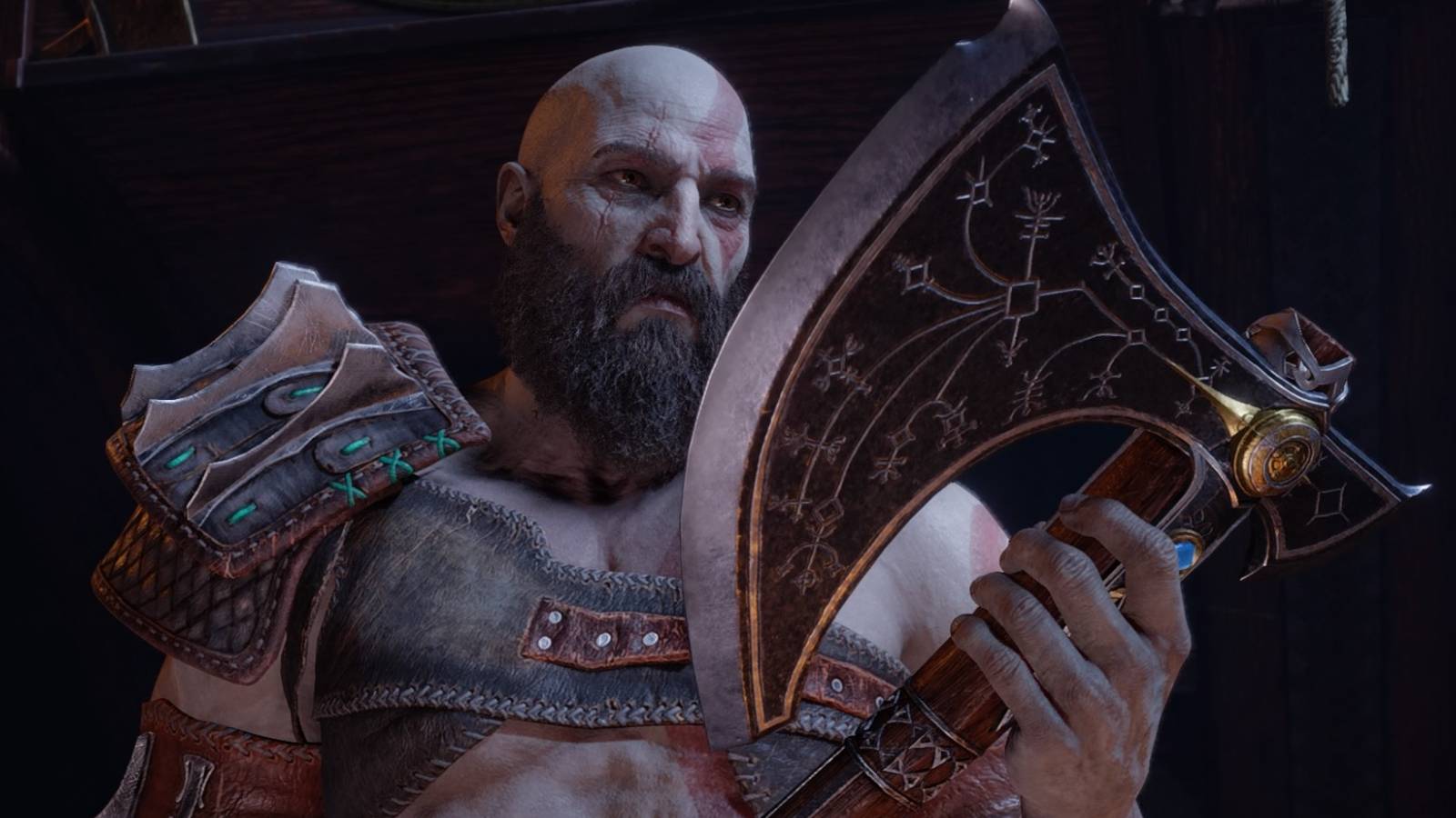 Kratos holds the Leviathan Axe in God of War Ragnarok