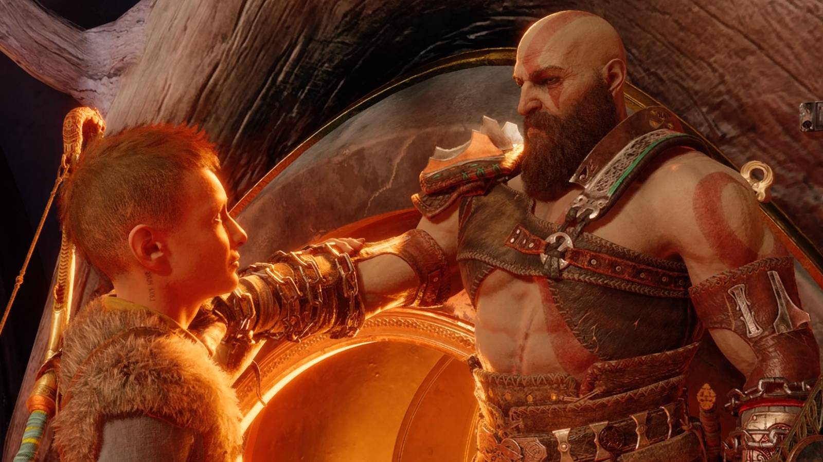 Kratos places his hand on Atreus' shoulder in God of War Ragnarok