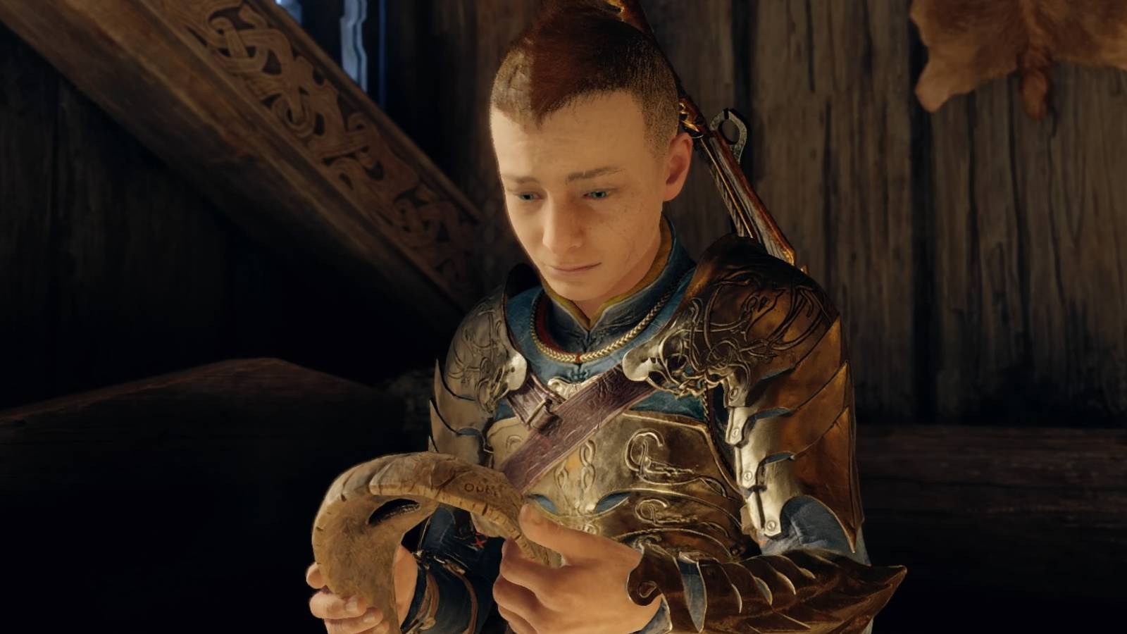 Atreus holds the mask in God of War Ragnarok