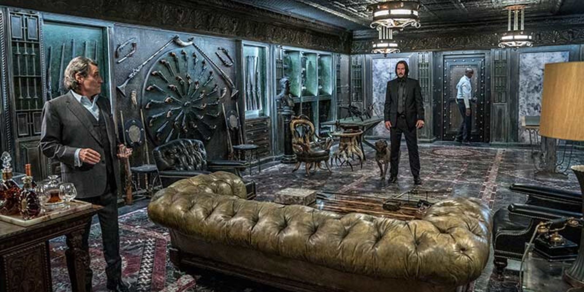 John, Winston, and Charon in the weapon room in John Wick Chapter 3 – Parabellum